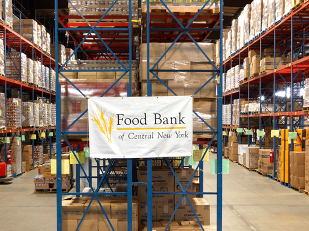 Food Bank banner hanging in warehouse.